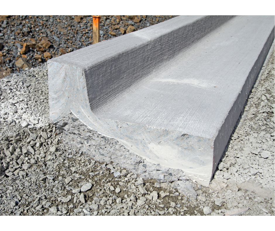 Concrete curb on a gravel surface